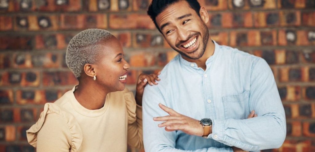 man and woman happyy complimenting each other