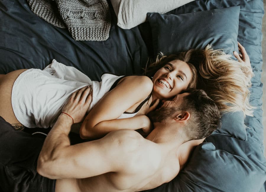 Couple enjoying time set aside for intimacy for a better sex life