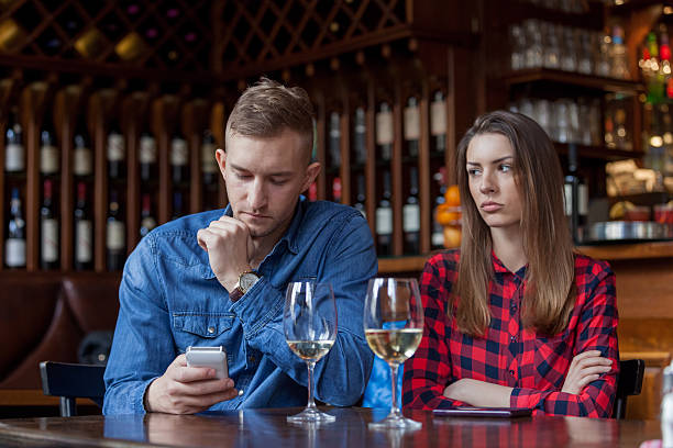 man having poor etiquette when out on a date