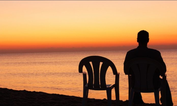 lonely in a relationship cover A man Seating alone iwith an emtpty chair next to him showing how one can be lonely in a relationship